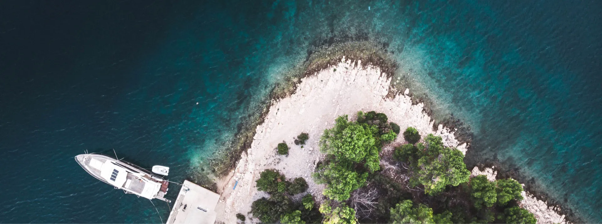 Wild rocky cove and turquoise water on Krk's southern coast near Stara Baška
